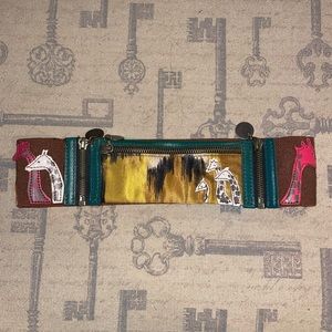 Anthropologie giraffe zipper belt with elastic. Never worn. With zipper pouch.